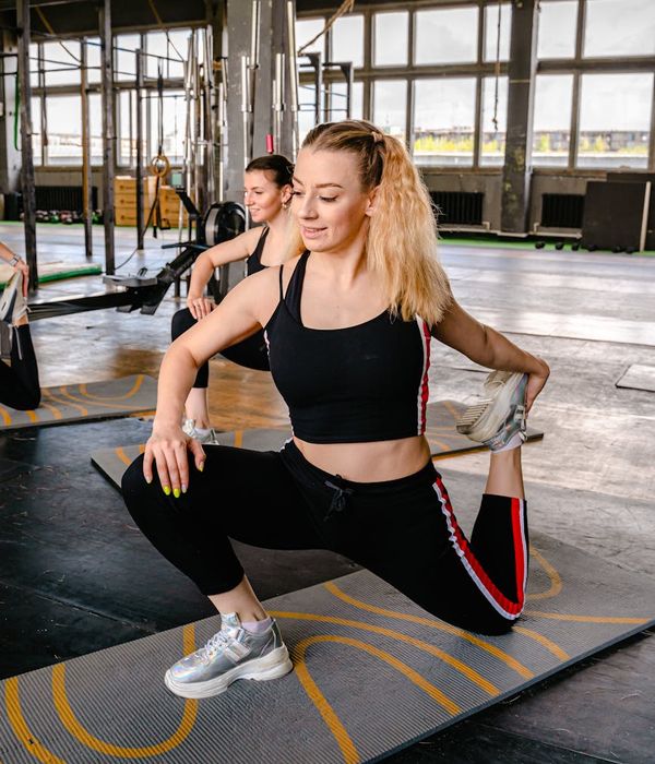 Smiling woman in sportswear feeling energetic and positive.